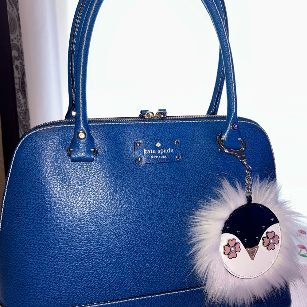 Kate Spade Blue Satchel does not include Penguin Charm